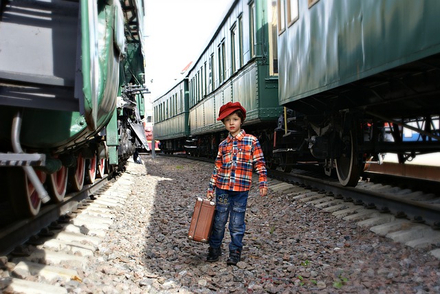 boy dressed up n train at museum
